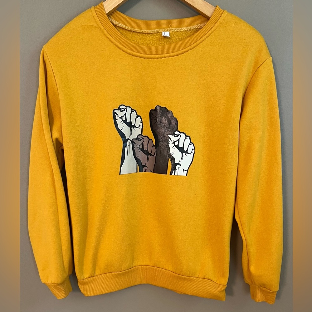 Black Lives Matter Long Sleeve Sweater Featuring Raised Solidarity Fists